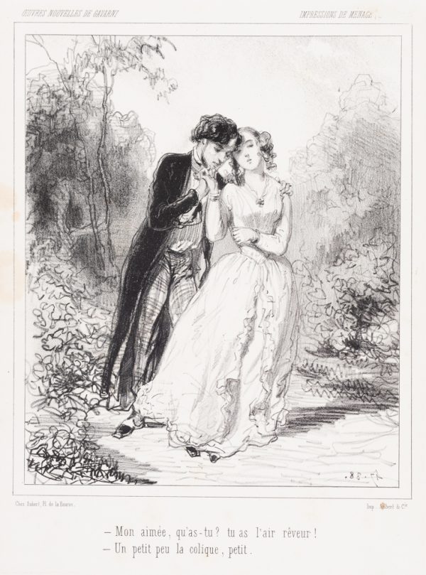A couple walk in a landscape. The man holds her hand to his chin and his other arm is around her shoulder.