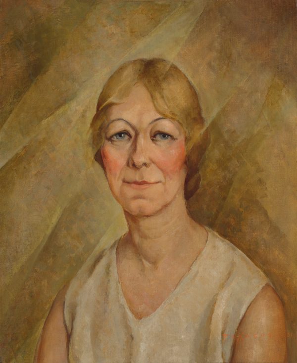 A portrait of a smiling woman.