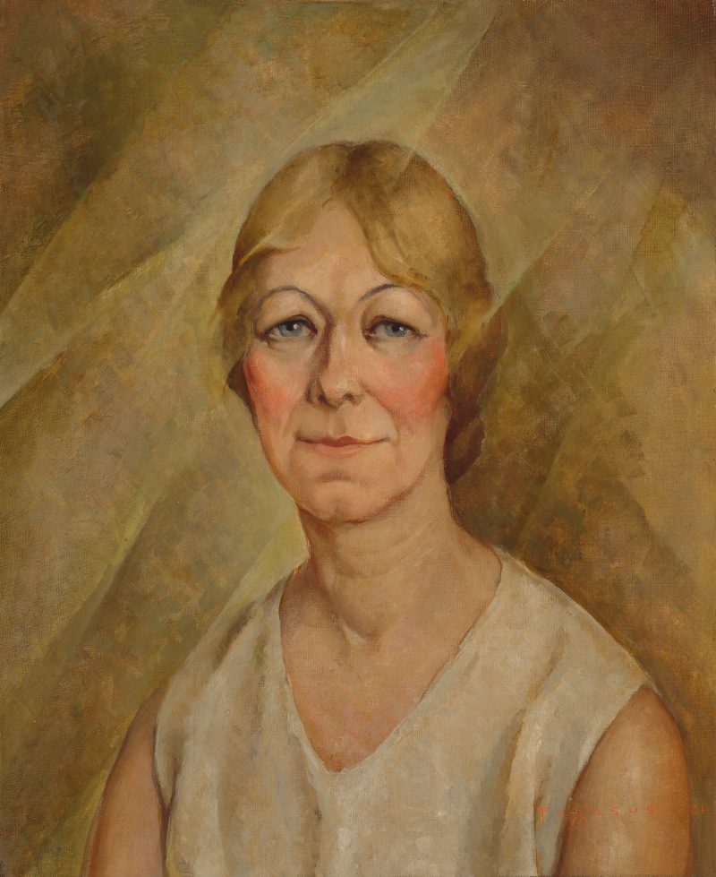 A portrait of a smiling woman.