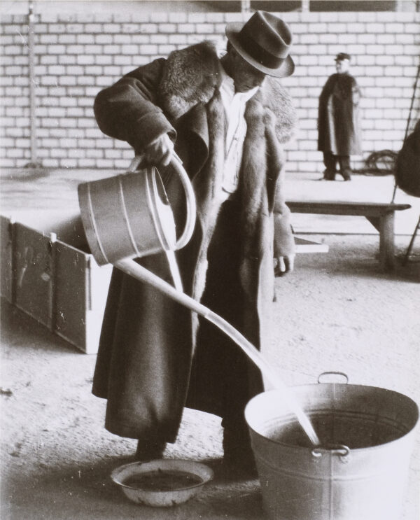 Joseph Beuys with watering can. Still photograph from a performance piece which took place in Basel, Switzerland in 1971.