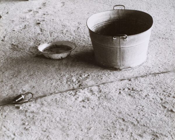 Bucket and pan. Still photograph from a performance piece which took place in Basel, Switzerland in 1971.