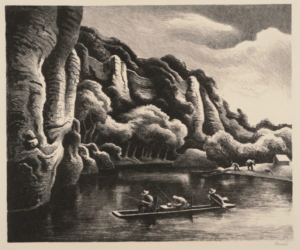 A three men are in a canoe on a lake in front of some tall cliffs with another group at the shore starting to 