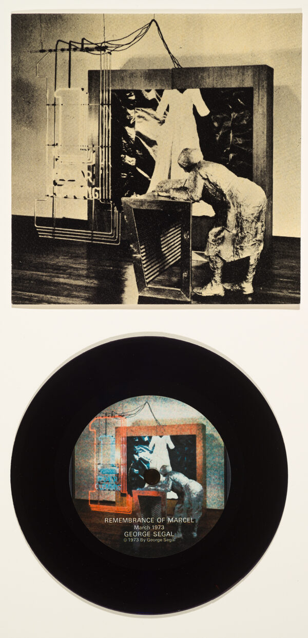A real record is in the bottom half. On the record and on the top half are the same images of a woman leaning on a counter with a neon sign to left of the woman. The record image is in color and the top image is in sepia tones.