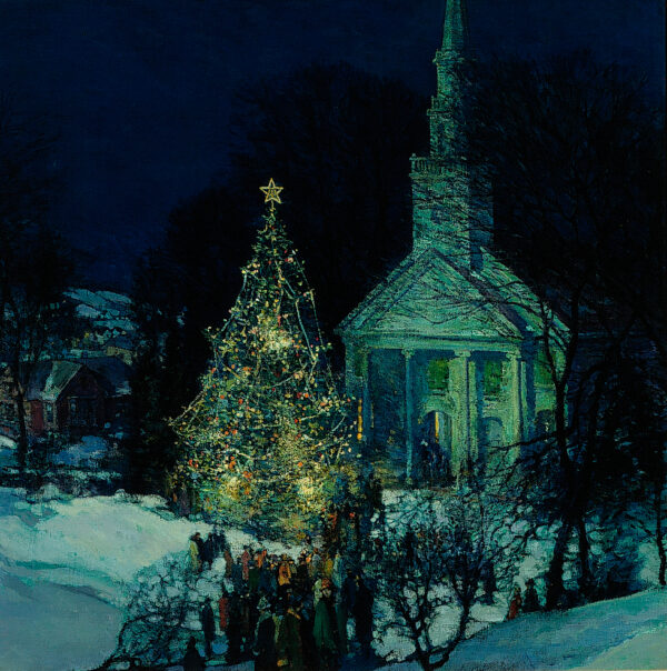 A night scene of a church with a lit Christmas tree in front.