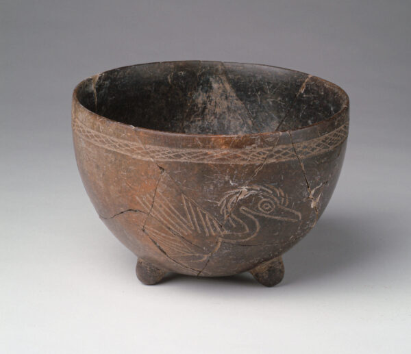 A tripod bowl with incised bird on the side.