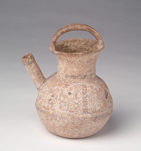 Pitcher with handle across top lip.