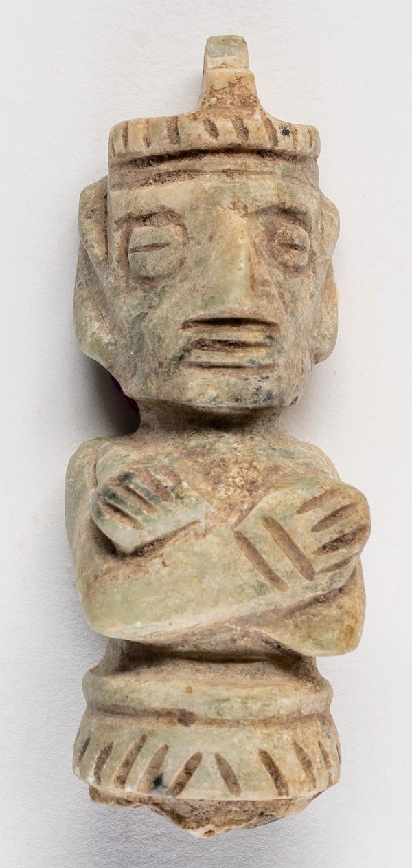 Amulet of man with arm crossed over chest.