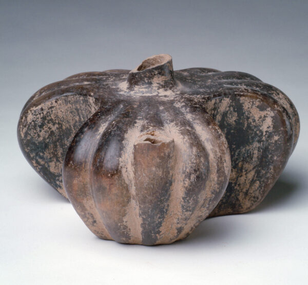 A three part squash shaped vessel with spout at stem.