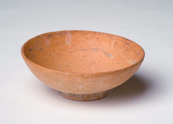 Footed bowl in red slip.