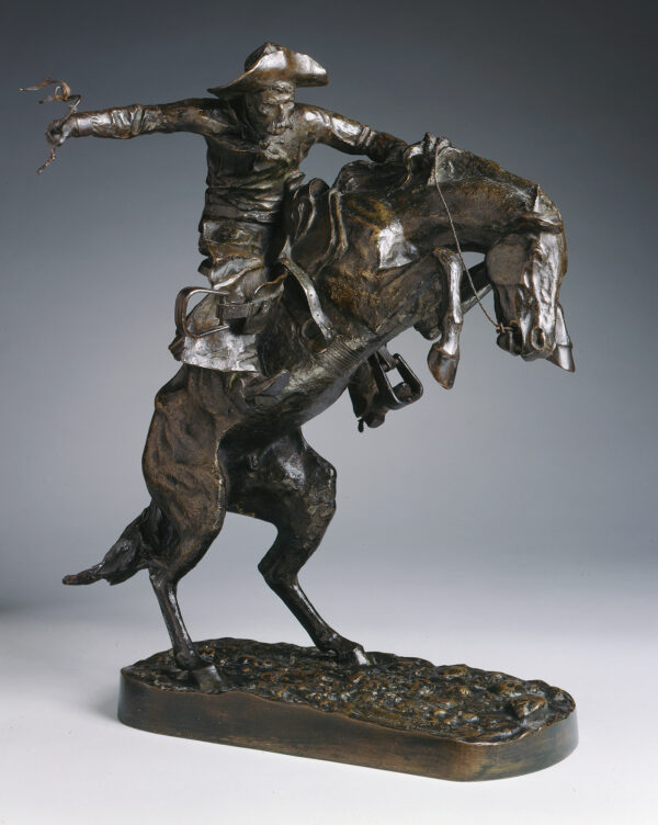A cowboy mounted upon a horse reared up on its hind legs. Cowboy is holding onto horse's mane and bridle with his left hand while his right arm is extended outward holding a whip. Cast by the Henry Bonnard Bronze Company Nos. 41-290 (approx.) cast by Roman Bronze Works