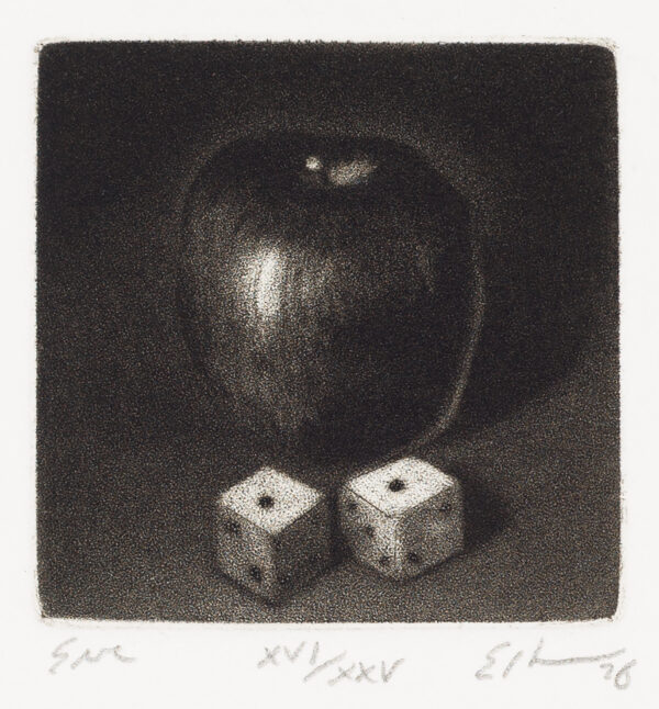 Two dice in front of an apple