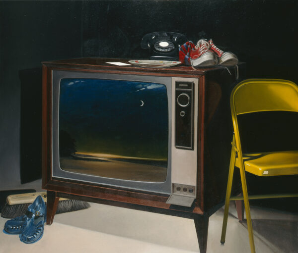 At center, a color TV cabinet with image on screen of a coastal scene with crescent moon; on top of TV, a plate, telephone & pr. of tennis shoes; at rt., a folding metal chair; at left, a pr. of sandals & a wide floor broom without handle.