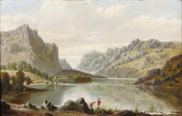 A lake with mountains in the background.