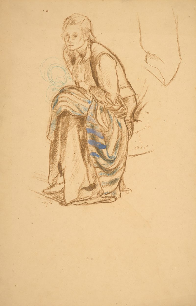 A seated woman with a coat draped over her knees.