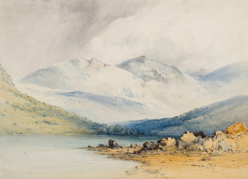 A landscape with lake and mountains in the background.