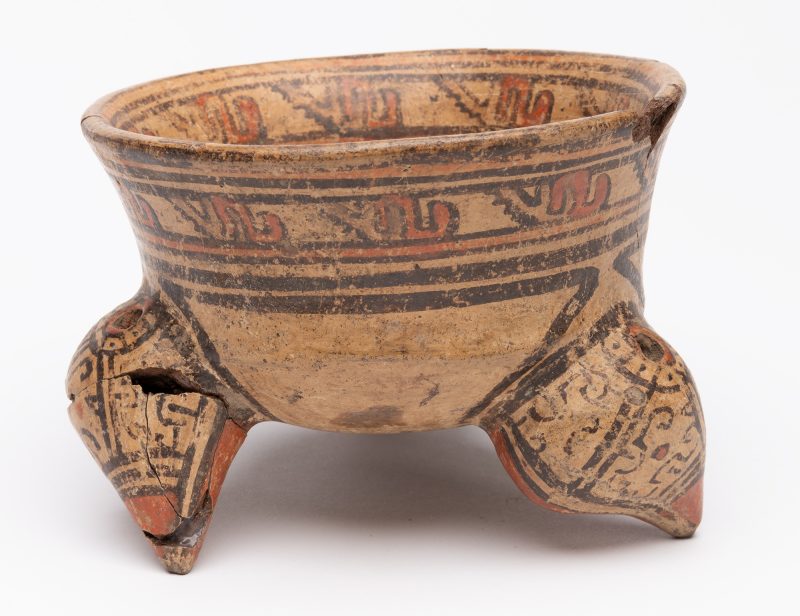 Tripod vessel with tan body and red and black slip decoration
