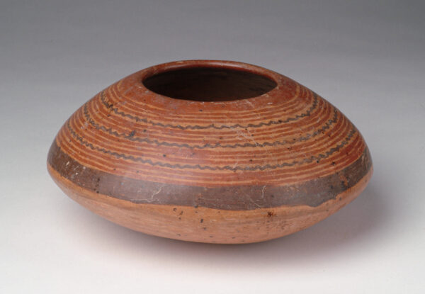 Bowl: tan body with red and black slip decoration.