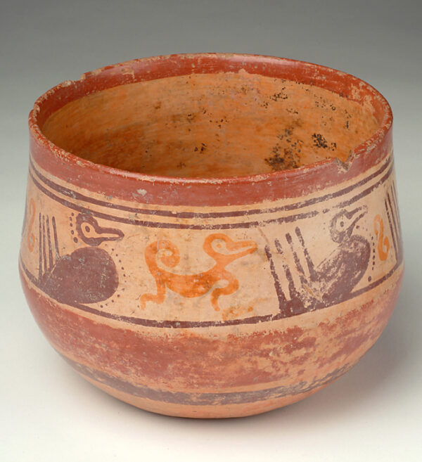 Bowl: tan with red, yellow and dark brown slip decoration of birds and monkeys.