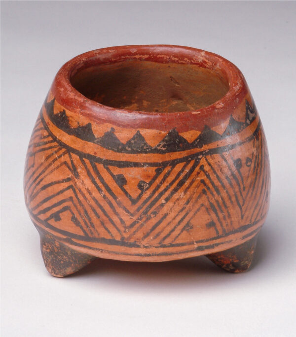 Footed vessel: red and black slip decoration.