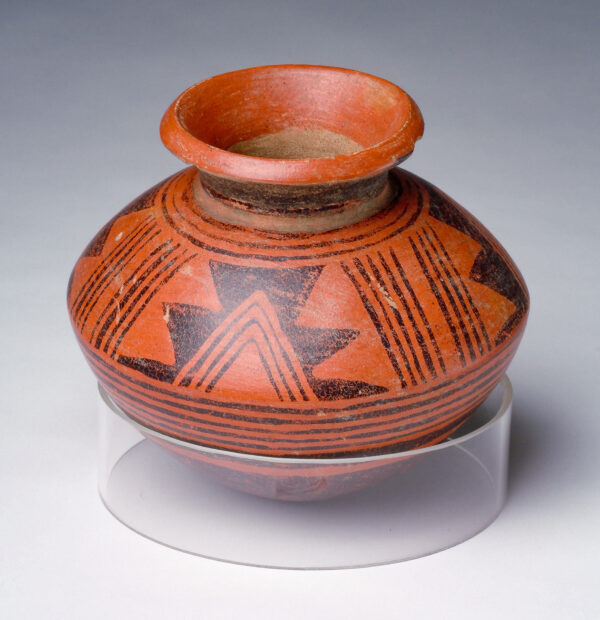 Olla with red and black slip decoration of lines and triangles.