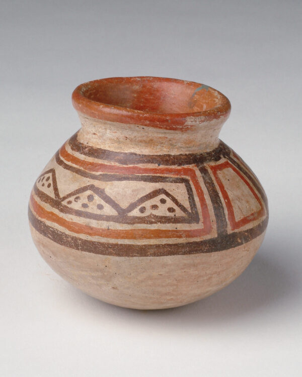 Olla with tan body, red and dark brown slip decoration.