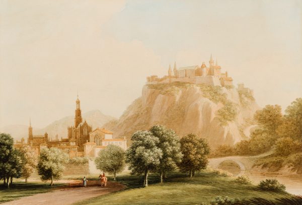 A castle on top of a mountain looking over a village.