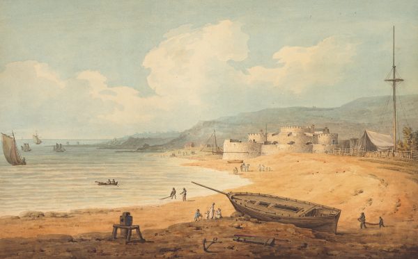 A curved beach with a boat in the foreground and buildings in the background.