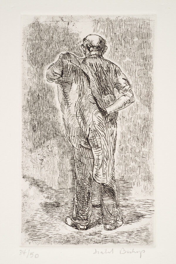 A man seen from behind putting on a jacket.