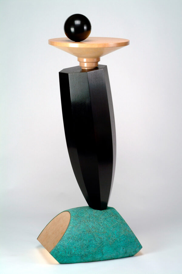 Sculpture has a green copper base wih gilding on sides, an ebonized multisided center, a small lacewood table with an ebonized sphere on top.