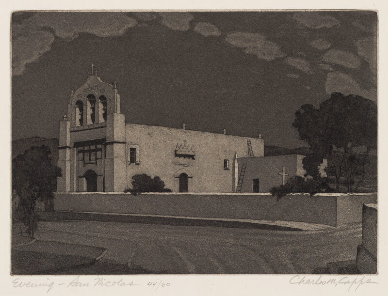 A Southwest adobe church is seen at night. There are trees at left and right and hills in the distance. San Nicolas de los Garza is now part of the metropolitan area of Monterrey, Mexico.
