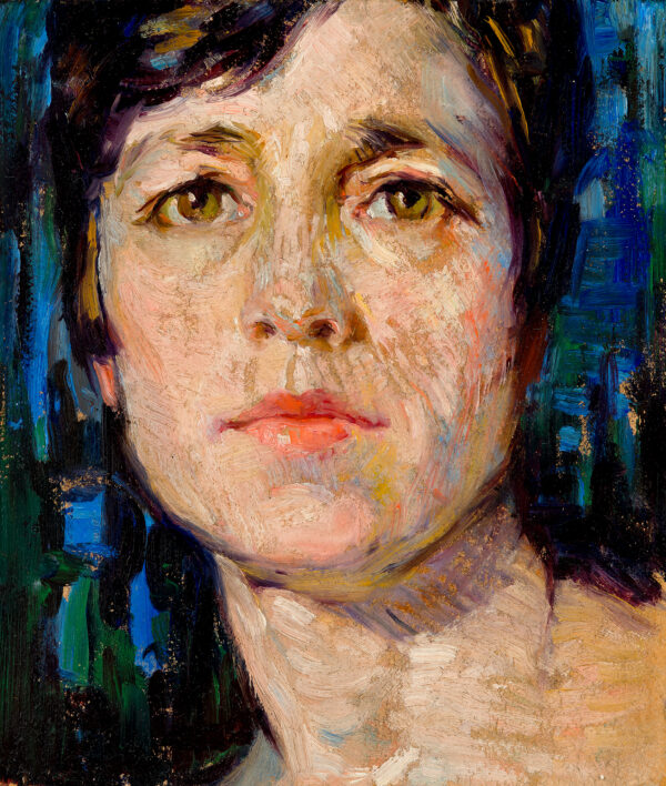 A portrait of a woman, closely cropped to her head and neck.
