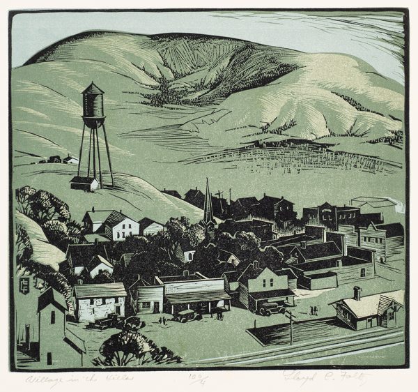 A bird's-eye-view of a villiage with a watertower and hills in the background.