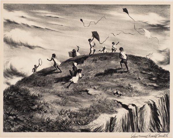 View of children flying kites on a hilltop.