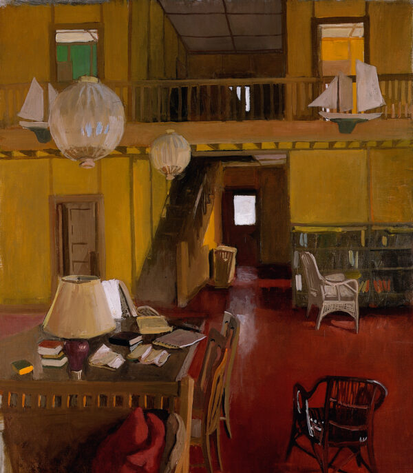 The living room in the Porter family house on Great Spruce Head Island, Penobscot Bay, Maine; The house was designed by Fairfield's father is two stories high. Pictured is a table with lamp and books at lower left, chairs scattered about, staircase leading to a balcony with bedroom corridors, the walls painted chrome yellow, two Japanese lanterns suspended from the ceiling and two large toy sailboats attached to the balcony railings.