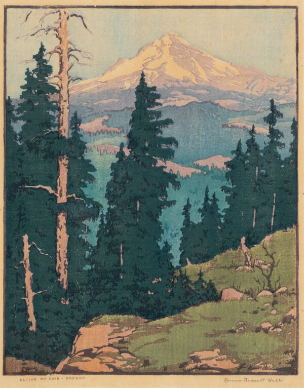 Mountain scene; view from a rocky precipice edged with dark green pine trees stretching from left foreground to right middle ground; looking over mountains and beyond to Mt. Hood, Oregon, rising above all.
