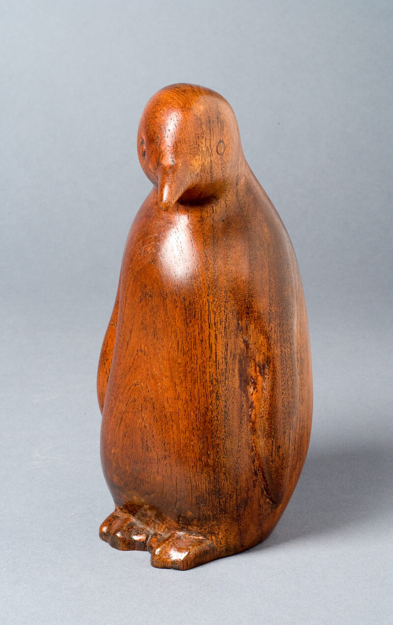 Carved wood penguin