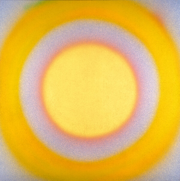 A painting mostly in yellow but also with orange and white colors that has a circular motif like a bulls eye, explosion or sun. The painting has been created by spraying with a filler that leaves the surface roughly textured.