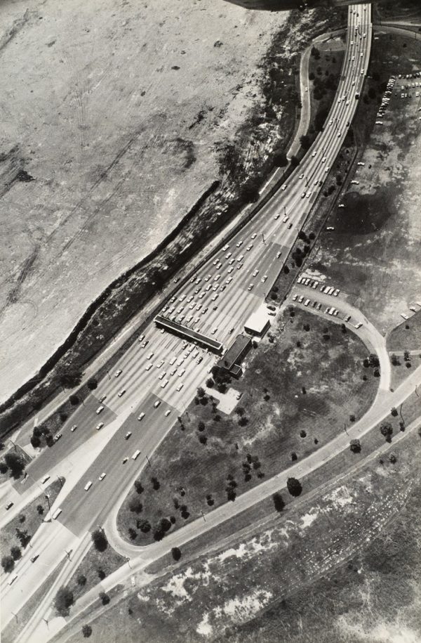 A toll booth with 13 lanes.