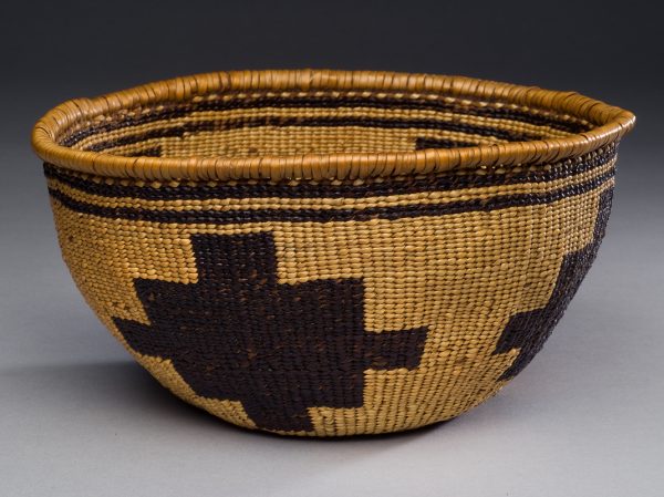 Tan bowl shape with bottom of light brown and four dark brown geometric shapes on the sides, two thin dark brown bands near the rim.