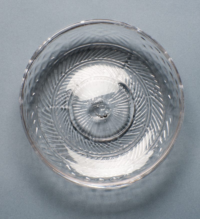 A small shallow bowl blown with 3-molds and a folded-tooled rim.