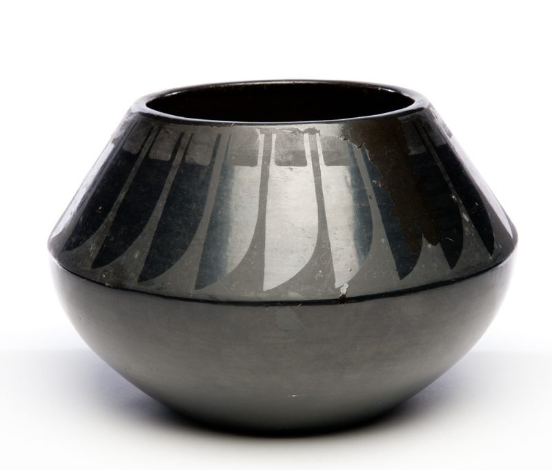 Black on Black with feather design around upper half of pot.