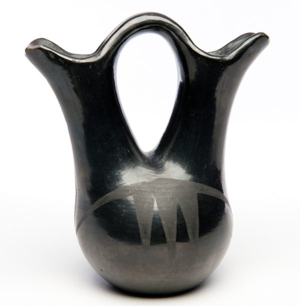 Black on Black vase with two spouts. The  design is of three simple inverted triangles.