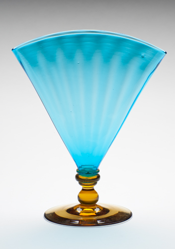 Blown glass  in celeste blue fan shape over amber foot
