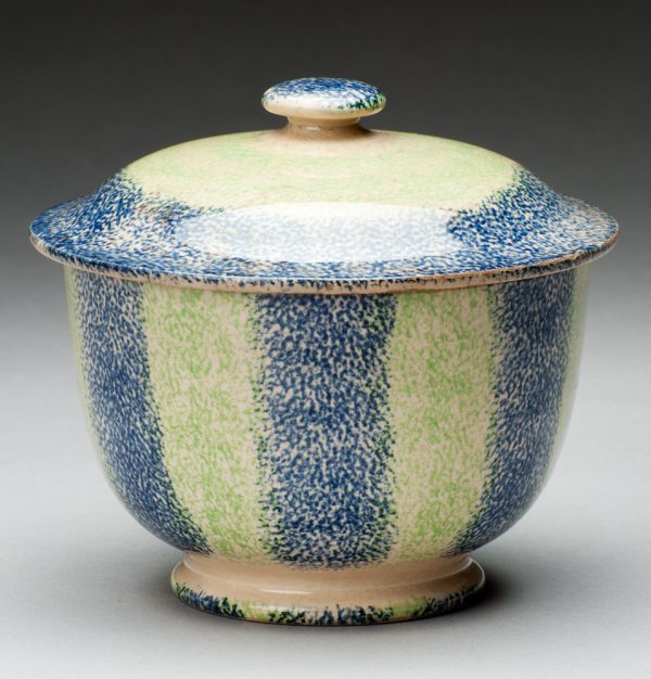 Spatterware sugar bowl in green and blue stripes.