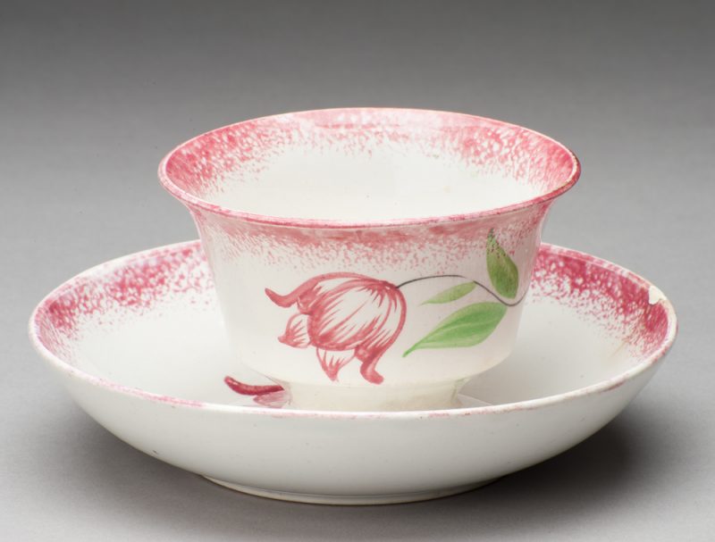 Spatterware cup in the Tulip pattern, red edge with red flower/green leaves