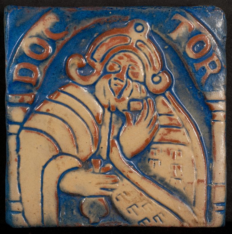 A tile of a figure holding a bottle, the word DOCTOR above