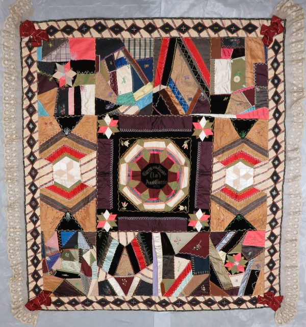 A crazy quilt with medallen center and 4 3/4