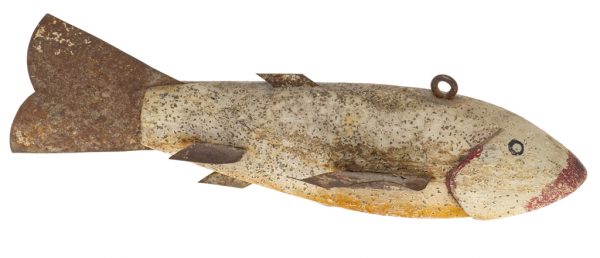 A white speckled fishing lure with rust color fins and tail. The nose, under the mouth and gills are red. The speckles are reflective.