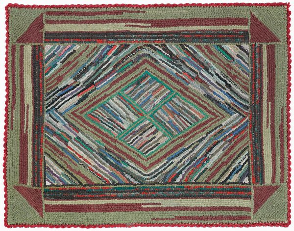A hooked rug of multipcolors in a geometric pattern with red crocheted edge. The center diamond has four segments. The outer border has a red triangle at each corner.
