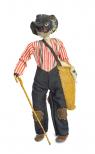 A walnut head doll. A man has a white beard, red and white stripped shirt, pants with patches at the knees, a hat, a cane and a bag of cotton.